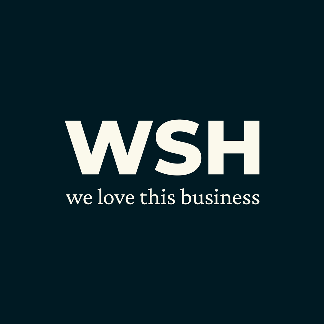 A logo for WSH with the strapline "we love this business"