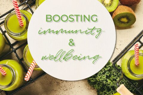 Immunity. A kiwi background with a circle on with the text "Boosting immunity and wellbeing" on.