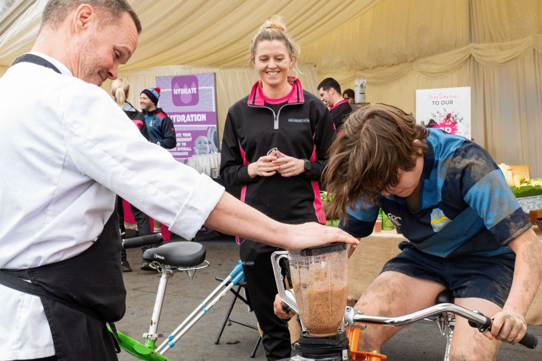 An image of a pupil riding a bike that makes smoothies