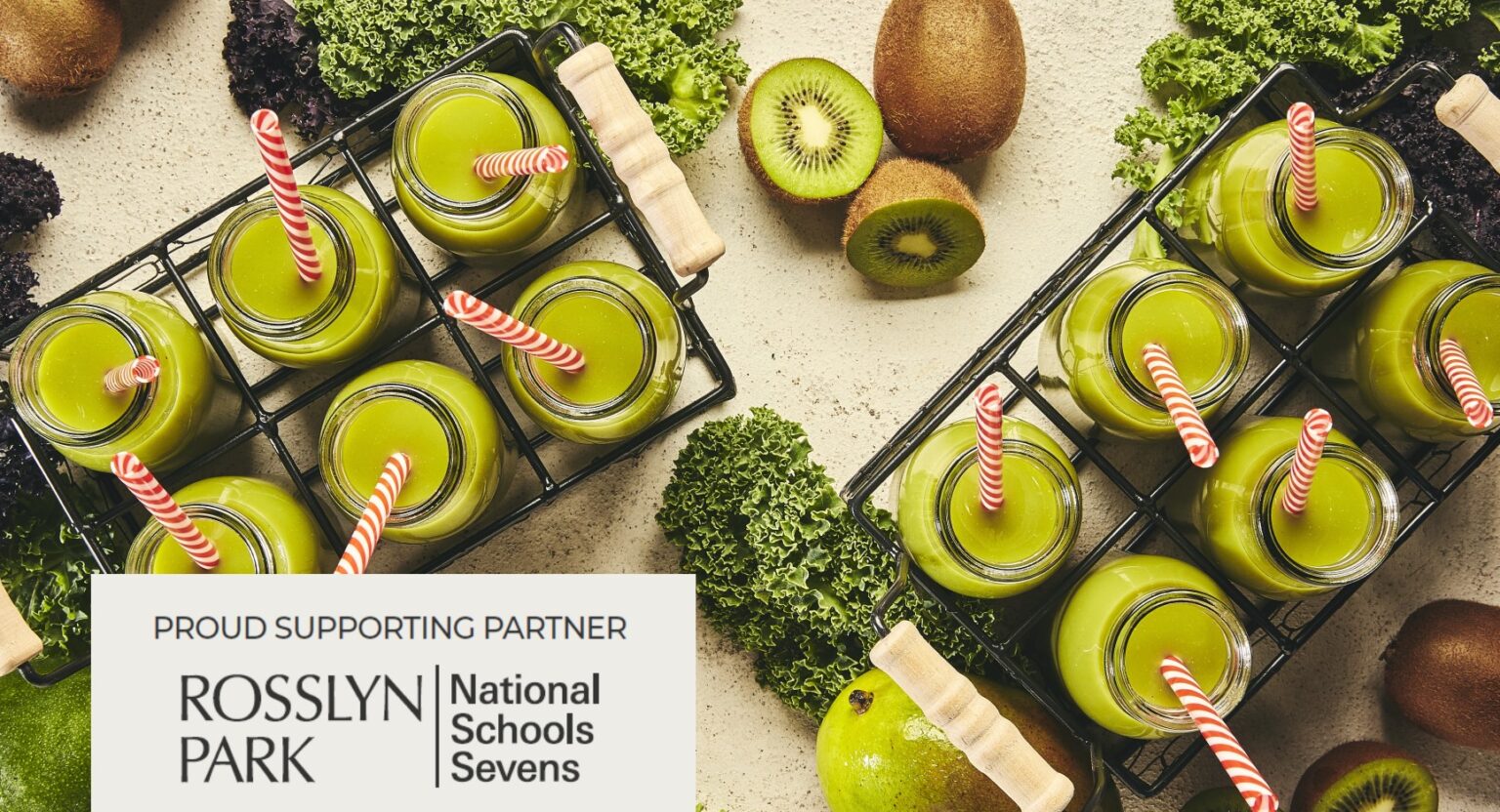 A selection of green kiwi smoothies in glass jars. In the bottom left corner, there is a logo with the text "Proud Supporting Partner Rosslyn Park National Schools Sevens."