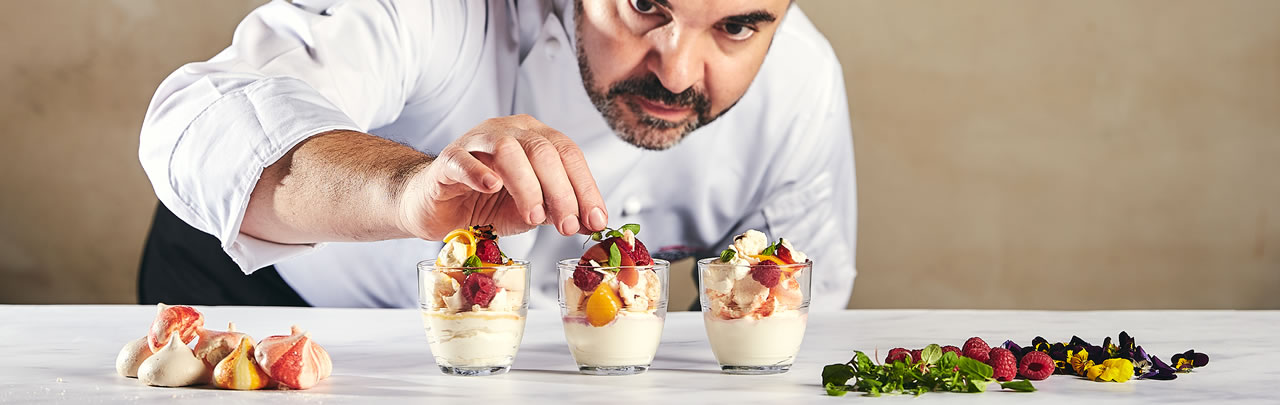 Careers. An image of a chef with three dessert pots