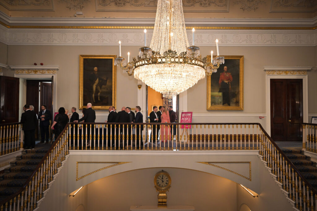 People Awards. An image of a georgian building with people mingling ahead of the event.