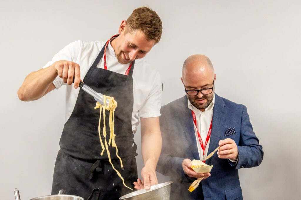 Home 34 Holroyd Howe chef serving fresh pasta to a guest